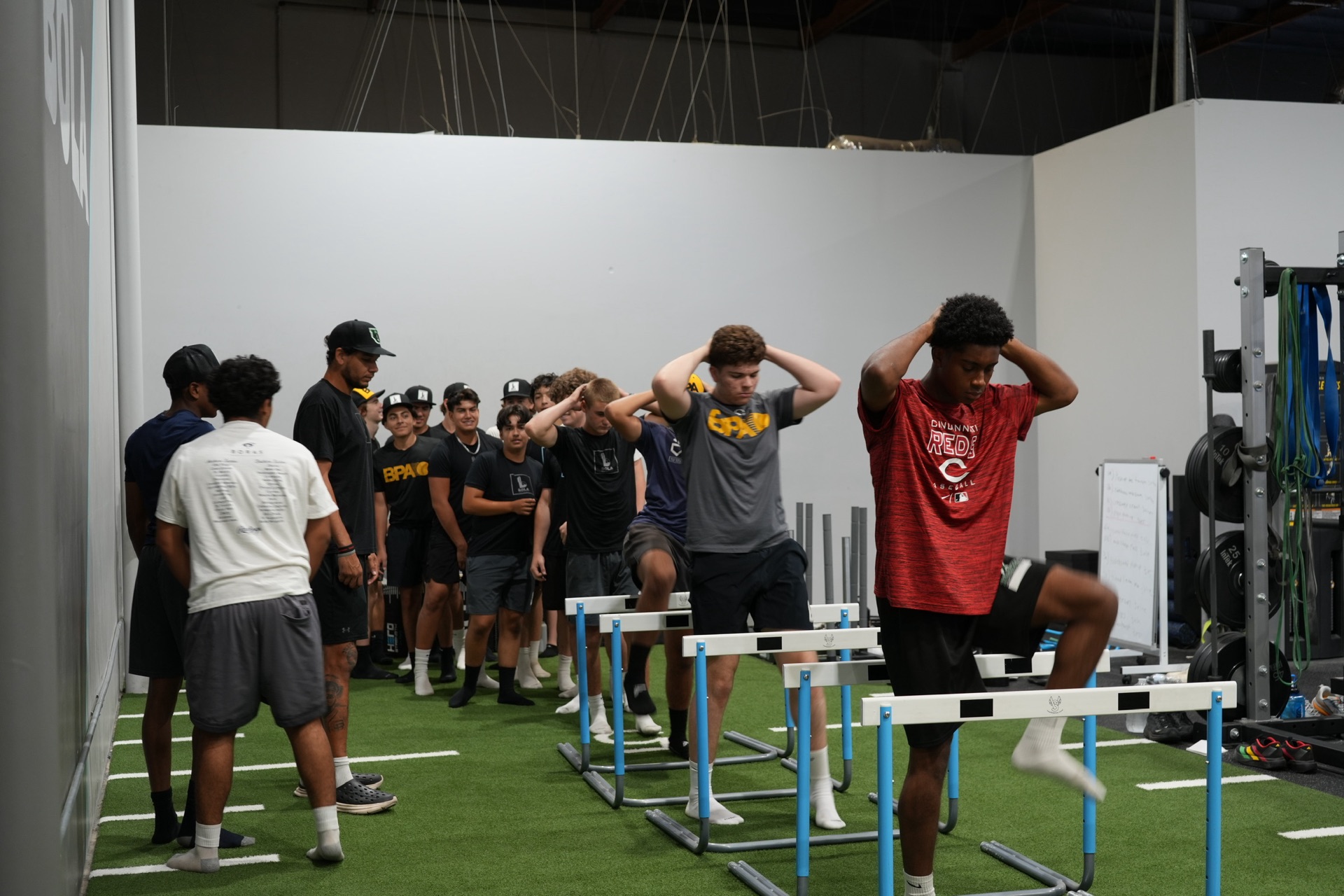 Bola Prep Academy athletes doing a hurdle agility drill