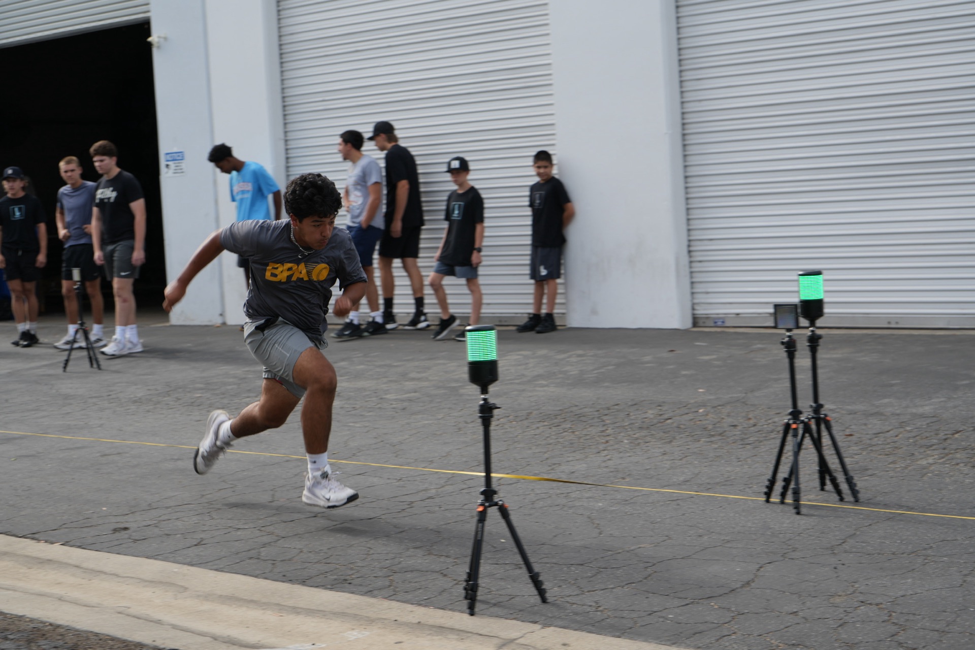 Bola Prep Academy athlete sprinting through timing gates