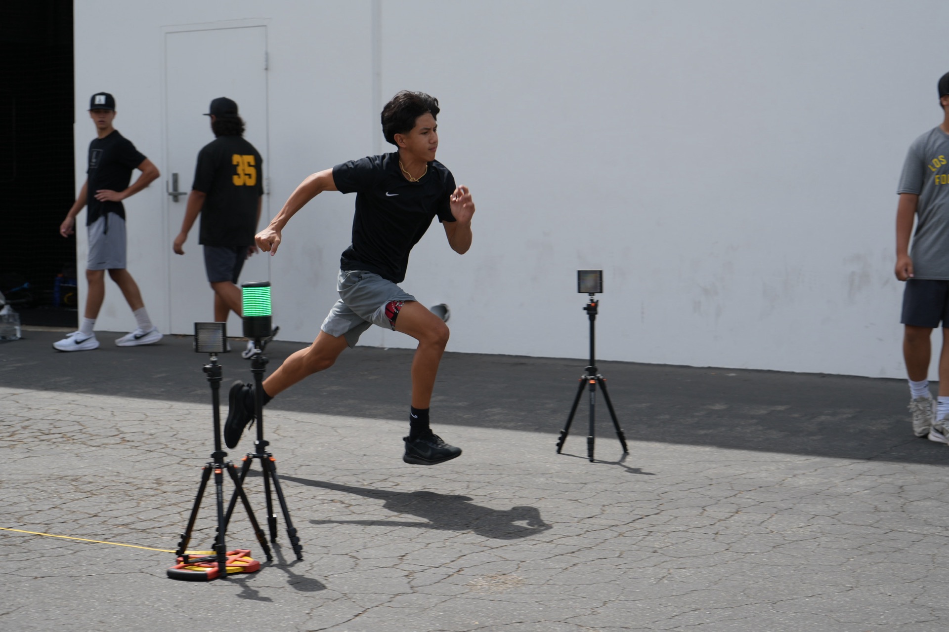 Bola Prep Academy athlete sprinting through timing gates